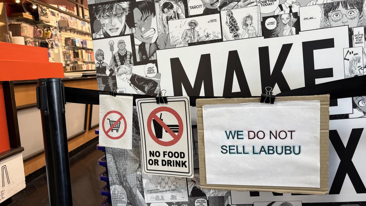 Handwritten sign clipped to a store barrier reading We Do Not Sell Labubu